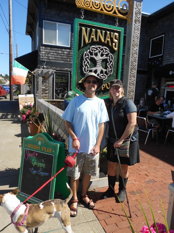 Man and woman in front of Nana's Pub in Newport