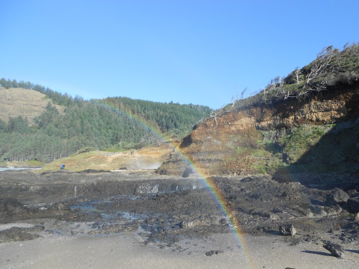rainbow with hills in background