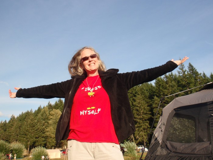 Woman wearing Simpsons t-shirt next to tent